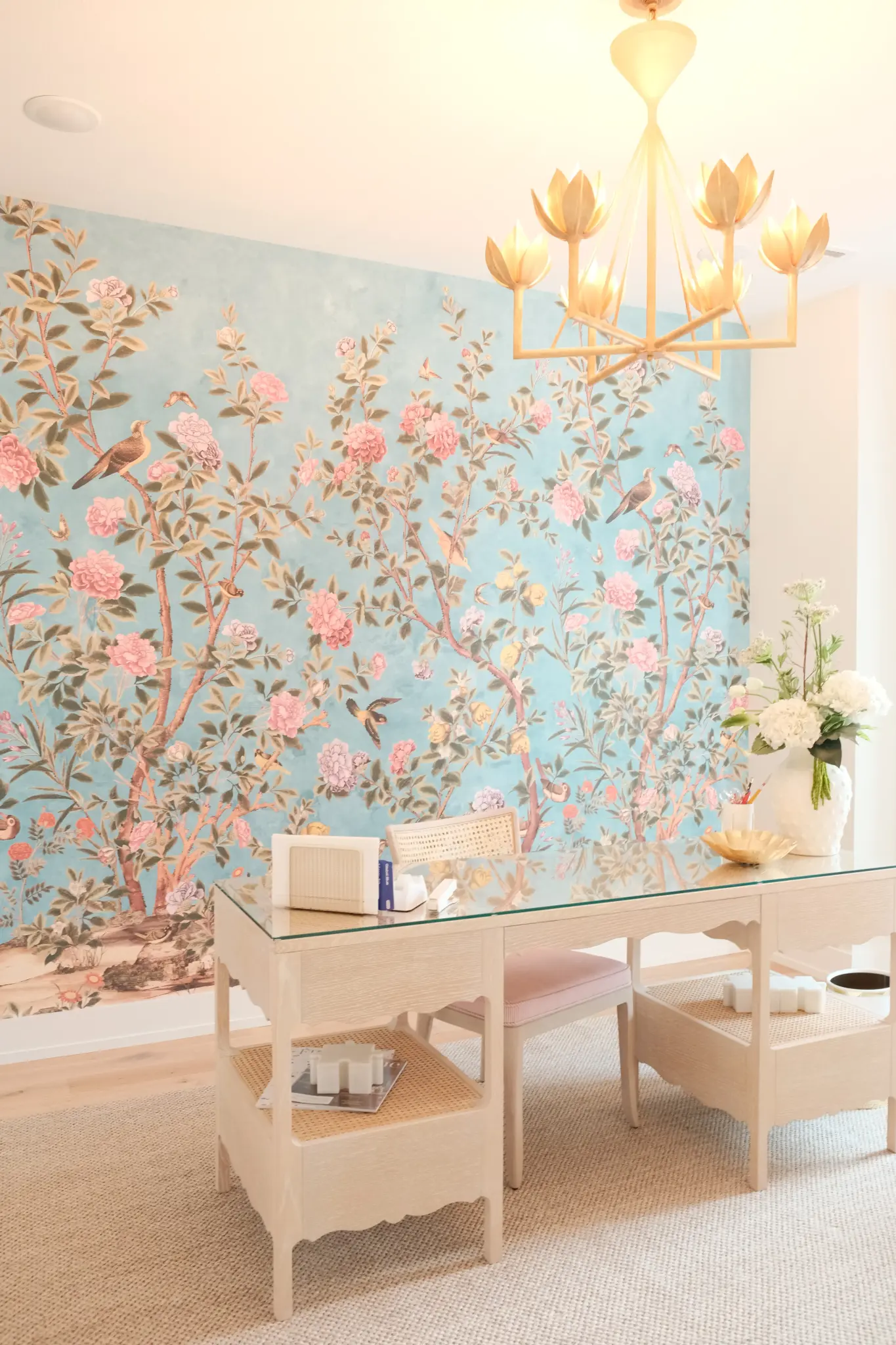 Statement lighting anchoring a designed space